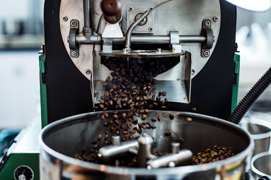  a coffee roaster releases beans