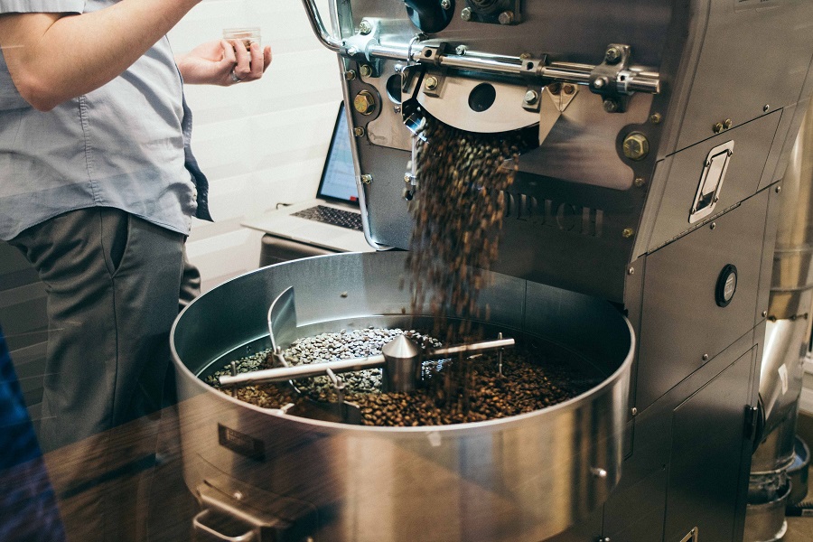 A roaster looks at coffee beans