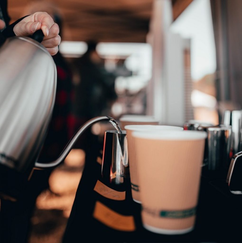 A barista serves coffee in Colorado