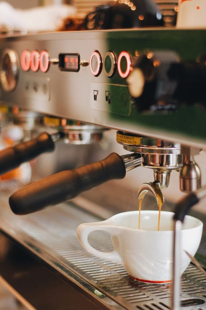 https://coffeeshopstartups.com/wp-content/uploads/2021/06/espresso-being-extracted-from-an-espresso-machine-680x1024.jpg