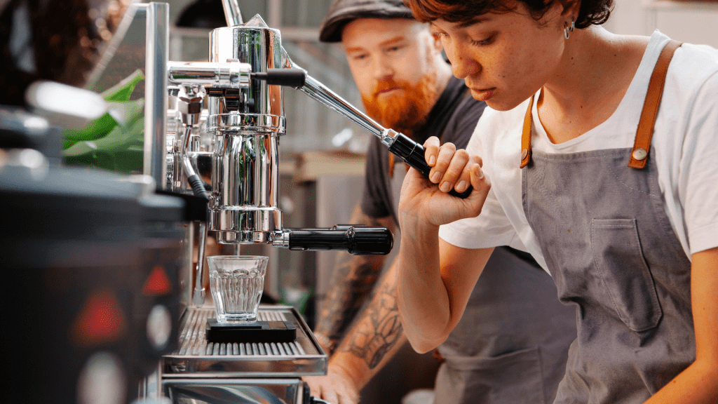 a barista pulls an espresso shot.