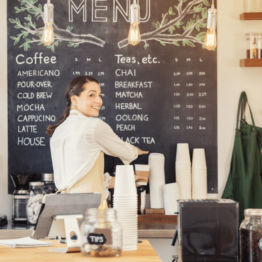 A barista serves coffee in Michigan. She started a coffee shop.