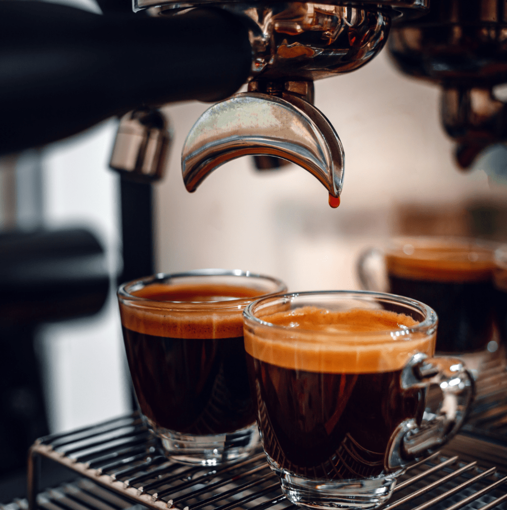 A barista serves two espresso shots in Hawaii. Start a Coffee truck in Hawaii.