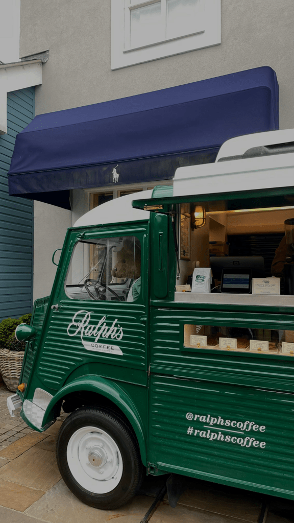 A green coffee truck on the street