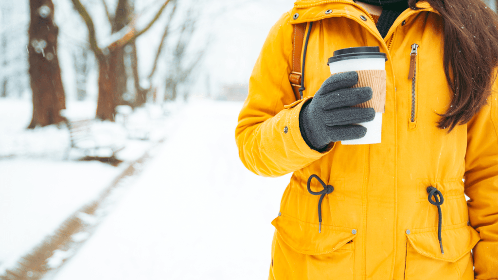 A coffee truck customer gets her coffee.